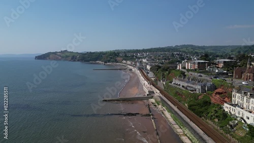 Wallpaper Mural Dawlish, South Devon, England: DRONE VIEWS: The coastline at Dawlish featuring the railway track and station, the beach, sea, houses and town quay. Dawlish is a popular UK holiday resort (Clip 6). Torontodigital.ca