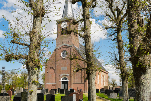 View of the 13th century Romano-Gothic Godeharduskerk in Marrum Friesland The Netherlands. The church was dedicated to Godehardus van Hildesheim.