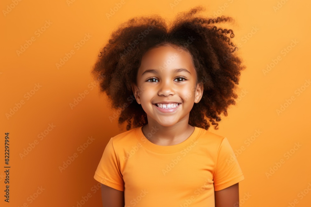 Orange background Happy black american african child Portrait of young beautiful kid Isolated on Background ethnic diversity equality acceptance 