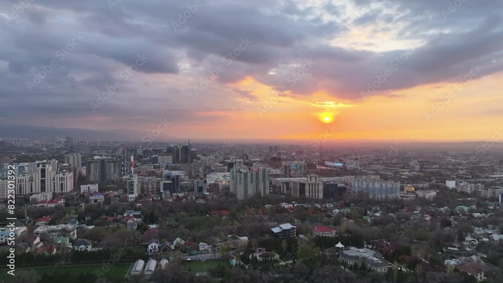 View from a quadcopter of the largest city of Kazakhstan, Almaty, on a spring evening at sunset View from a quadcopter of the largest city of Kazakhstan, Almaty, on a spring evening at sunset