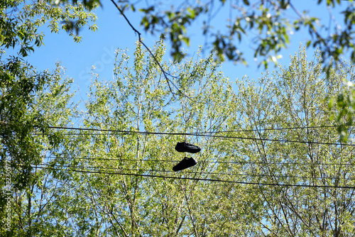 trainers hanging from electrical wires