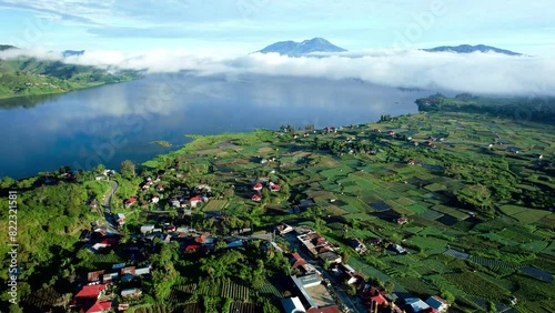 Establish Aerial View of the lake atas with a backdrop of Talang Mountain in Nagari Alahan Panjang, Solok Regency photo