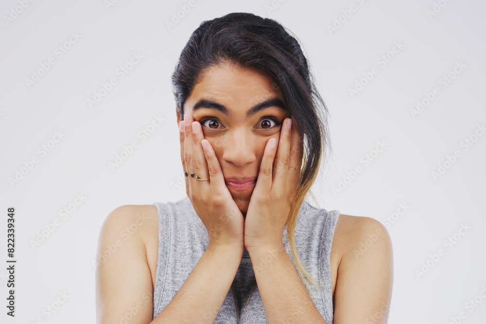 Surprised, portrait and hispanic woman in studio for gossip, drama or announcement on white background. Wow, covering face and shocked female person for fake news, wtf reaction or omg with mockup Surprised, portrait and hispanic woman in studio for gossip, drama or announcement on white background. Wow, covering face and shocked female person for fake news, wtf reaction or omg with mockup