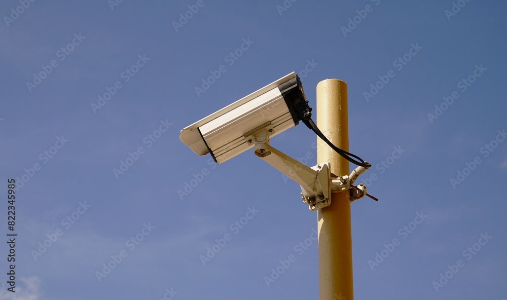 security camera in a post against the sky security camera in a post against the sky