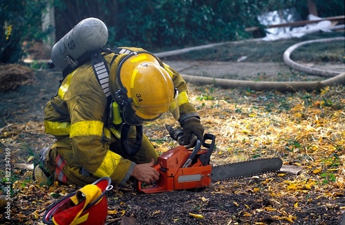 Fireman Starting Chainsaw photo