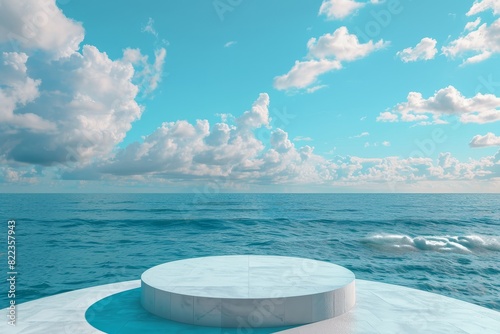 A large white round structure sits on a beach next to the ocean