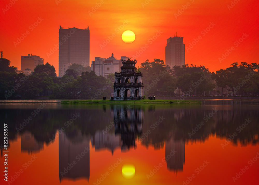 Turtle Tower on Hoan Kiem Lake at sunset in Hanoi, Vietnam. Vintage tone