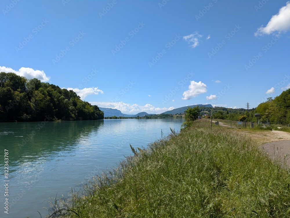 Naklejka premium View of Rhone derivation channel from road bridge of the Ecassaz, Via Rhona, Belley, France