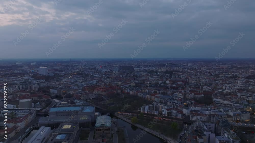 Fly through shot of Berlin at dusk, showcasing the city's skyline and iconic landmarks under a twilight sky Fly through shot of Berlin at dusk, showcasing the city's skyline and iconic landmarks under a twilight sky