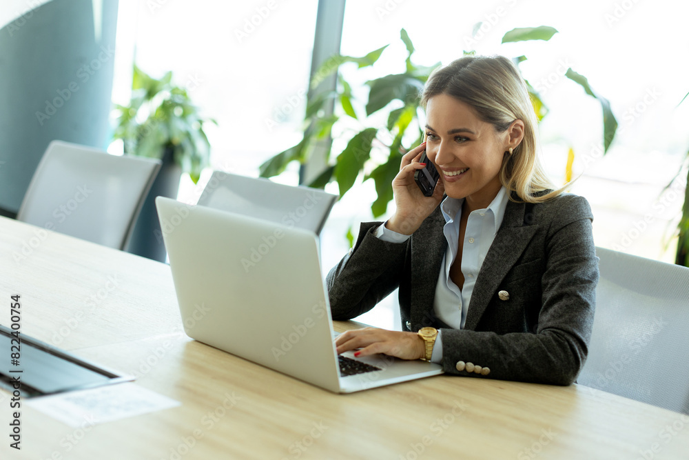 Bright morning business call in modern office setting with greenery Bright morning business call in modern office setting with greenery