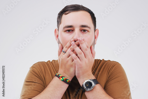 Announcement, surprise and portrait of man with news, crisis and info on white background in studio. Shocked, face and college student with crazy secret, gossip or reaction to drama at university