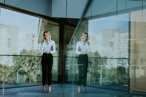 Professional woman standing...