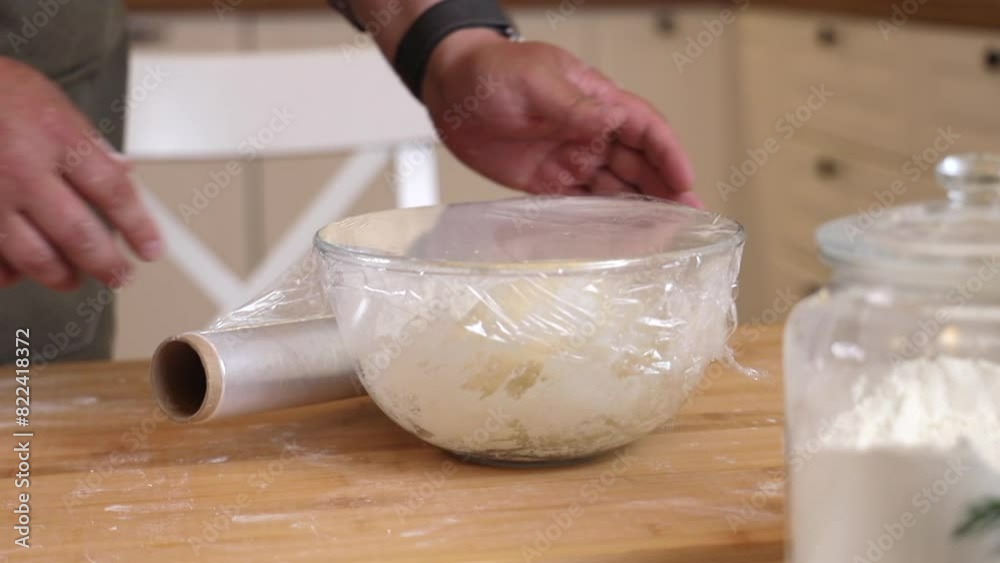 a male chef prepares the dough for making kutab a male chef prepares the dough for making kutab
