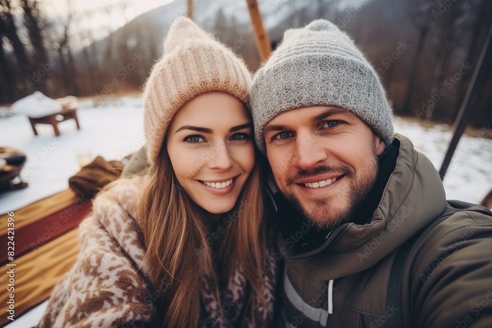 Generated with AI image of a smiling cheerful couple spending time winter picnic outdoors