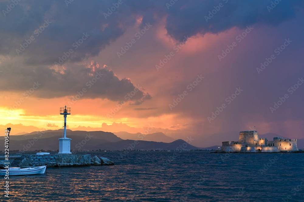Sunset over Bourtzi water fortress in Nafplio, Peloponnese, Greece