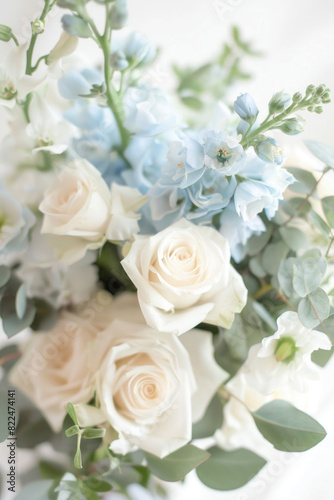 Small bouquet with white and light blue flowers on white background © Veniamin Kraskov