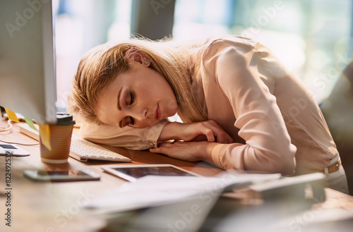 Sleeping, business and woman at desk in office for exhausted, tired and overworked from burnout of low energy. Corporate, person and fatigue with stress, nap and pressure from project deadline