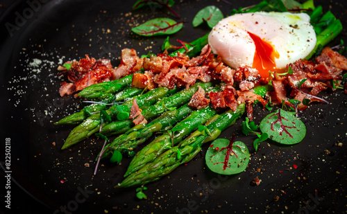asparagus with poached egg and fried bacon, micro greens and spices, breakfast, homemade, no people,
