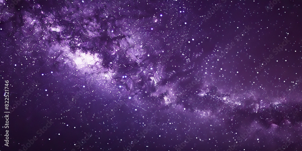 Obraz premium The deep purple night sky is filled with twinkling stars, the Milky Way stretching across it like a shimmering ribbon