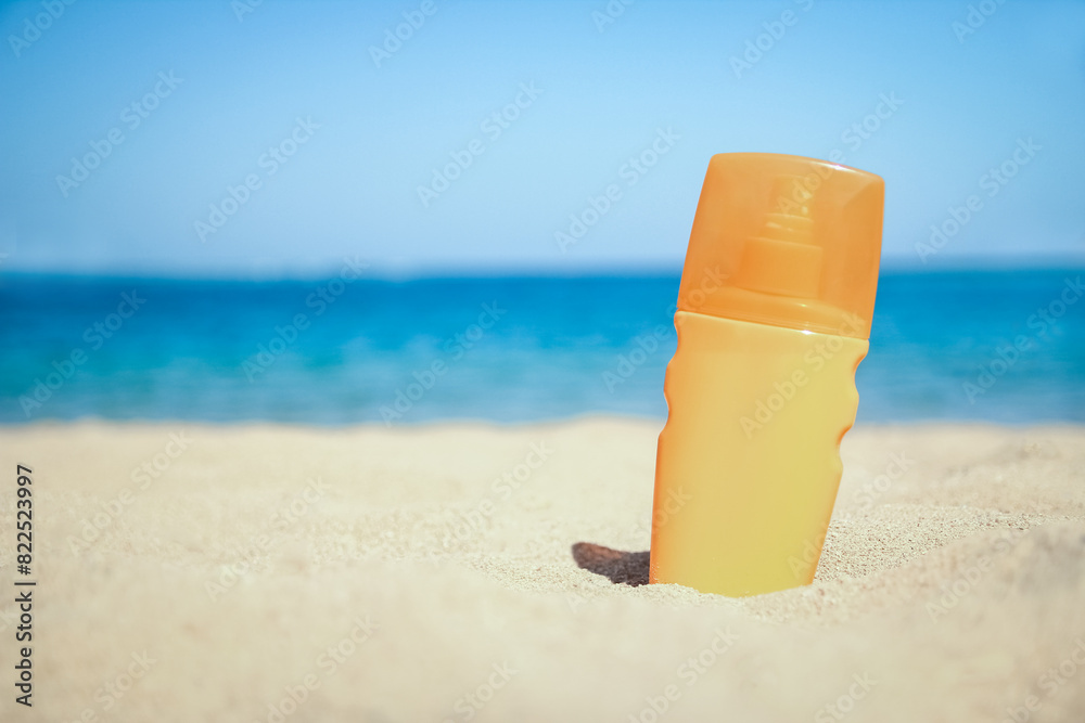 Stylish beautiful hat with cream on the seashore background Stylish beautiful hat with cream on the seashore background