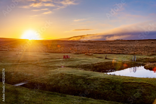 Stunning sunrise over the Scottish Highlands by the lace in the meadow photo