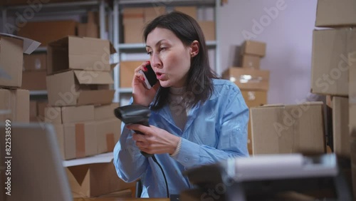 an overworked and stressed woman in the office does not have time to answer calls