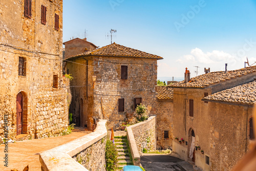 Medieval San Gimignano hill town with skyline of medieval towers, including the stone Torre Grossa. Province of Siena, Tuscany, Italy.