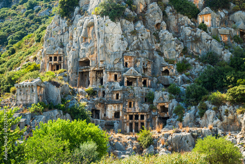 Myra archaeological site with rock tombs in Demre, Turkey. The Ancient City of Myra is especially famous for its Lycian-Era rock tombs, Roman-Era theatre photo