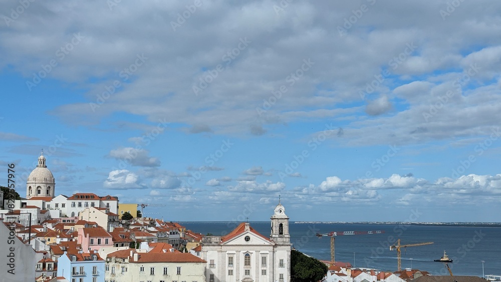 Panoramic view of Lisbon, Portugal with cityscape, buildings and boats on the Tagus River