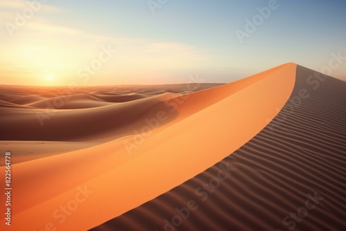 Peaceful desert landscape at sunset with smooth sand dunes and warm golden light