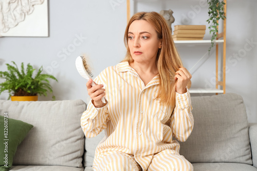 Worried mature woman in paj...