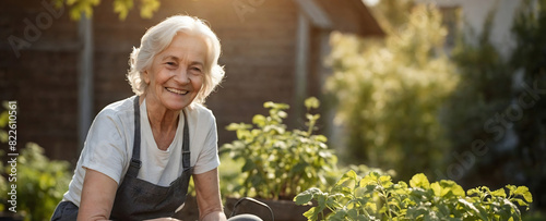 An old woman, a pensioner, prepares seedlings for planting in her garden.
