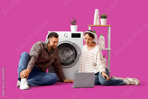 Young couple with laptop do...