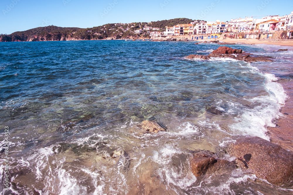 Fototapeta premium Beautiful beach landscape in touristic town village quiet waters in Costa Brava, Catalonia