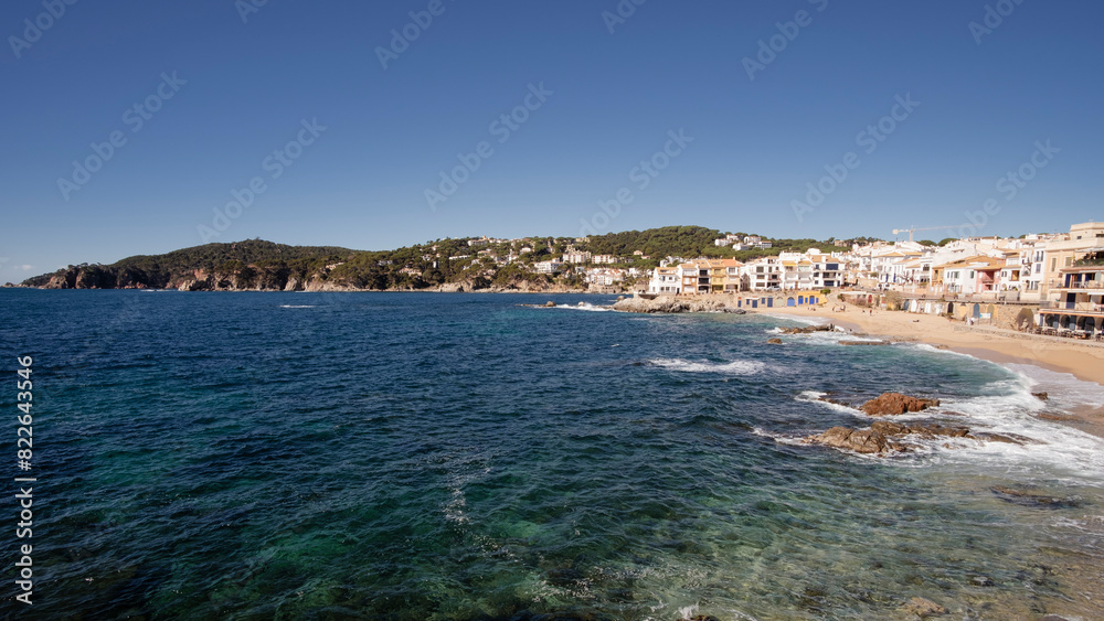 Fototapeta premium Beautiful beach landscape in touristic town village quiet waters in Costa Brava, Catalonia