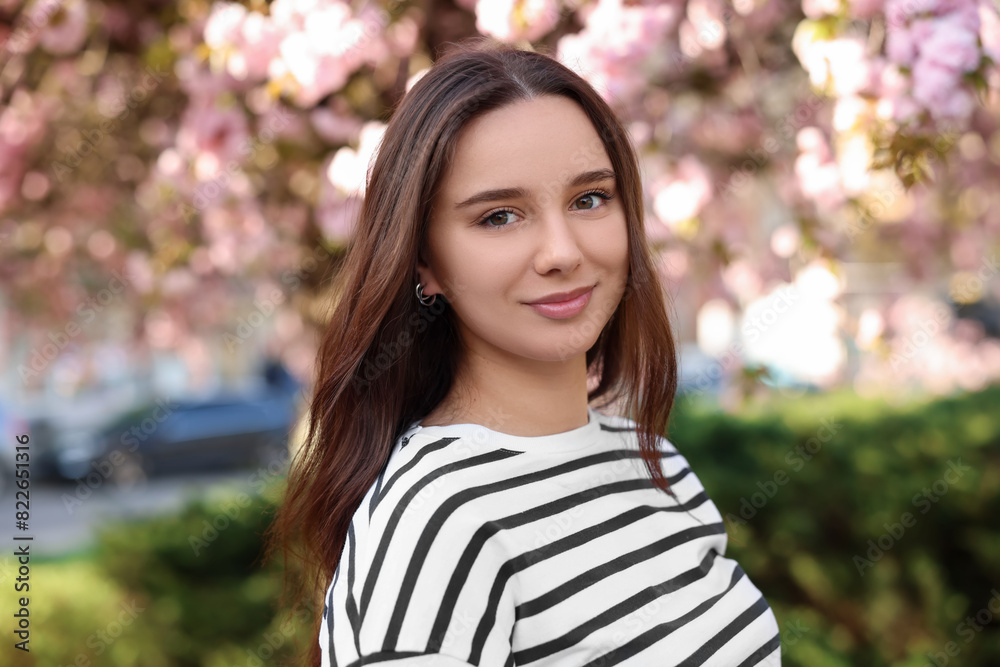 Beautiful woman near blossoming tree on spring day Beautiful woman near blossoming tree on spring day