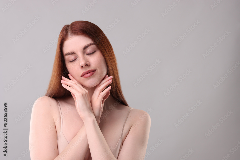 Portrait of beautiful woman on grey background. Space for text Portrait of beautiful woman on grey background. Space for text