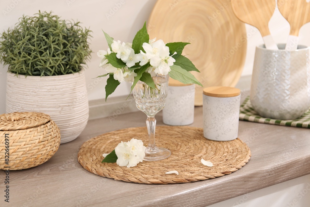 Beautiful jasmine flowers on wooden table indoors Beautiful jasmine flowers on wooden table indoors
