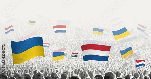 People waving flag of Netherlands and Ukraine, symbolizing Netherlands solidarity for Ukraine. photo
