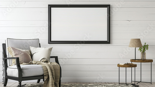 Elegant black frame on a white shiplap wall, above a cozy reading nook with a comfy chair and side table. photo