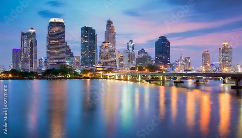 The vibrant Bangkok skyline illuminated against a twilight sky.