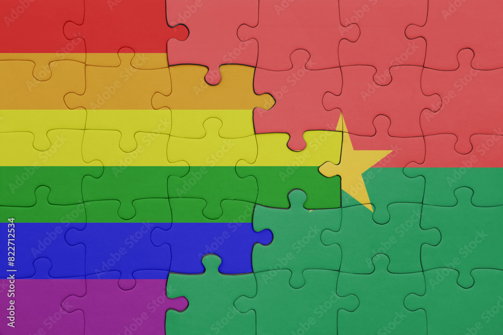 puzzle with the colourful national flag of burkina faso and rainbow gay pride flag . puzzle with the colourful national flag of burkina faso and rainbow gay pride flag .