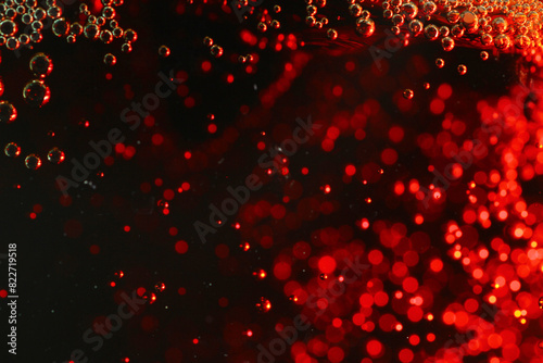 Macro shot of bubbles in fizzy cola drink photo