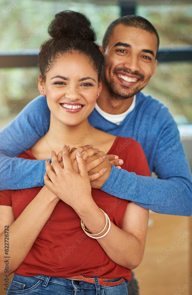 Fototapeta premium Portrait, home and couple with peace, hug and marriage with romance, happiness and bonding together. House, embrace and man with woman, support and relationship with care, trust and date with love