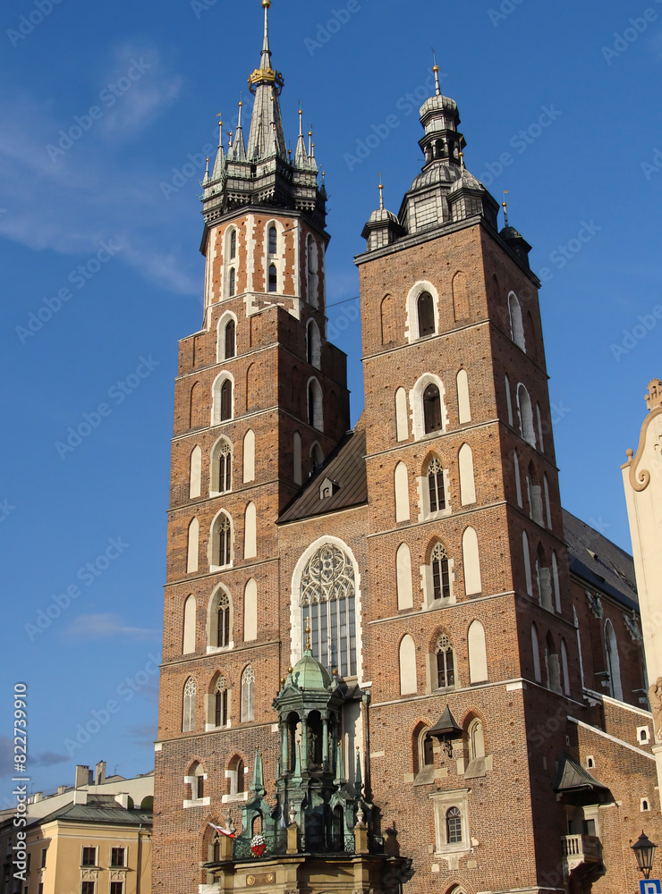St. Mary's Basilica, (Kościół Mariacki) is a beautiful brick Gothic church adjacent to the main market square in Kraków, Poland, is considered one of the finest examples of Polish Gothic architecture St. Mary's Basilica, (Kościół Mariacki) is a beautiful brick Gothic church adjacent to the main market square in Kraków, Poland, is considered one of the finest examples of Polish Gothic architecture