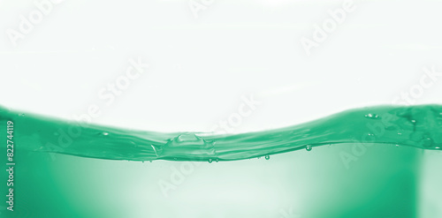 Green wave water surface ,ripple and bubbles isolated on white background.  photo