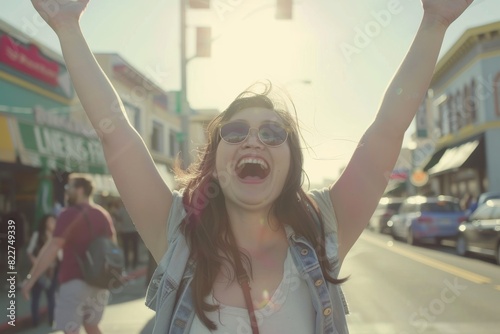 young beautiful hipster woman in the city street happy and excited celebrating success