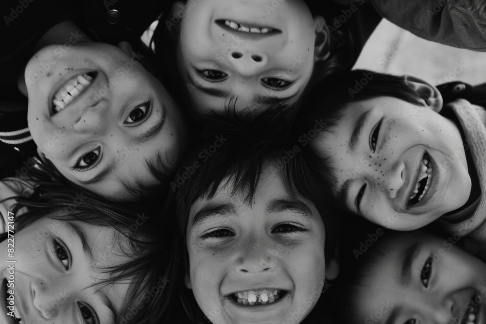 Group of kids looking at camera in black and white, happiness concept Group of kids looking at camera in black and white, happiness concept