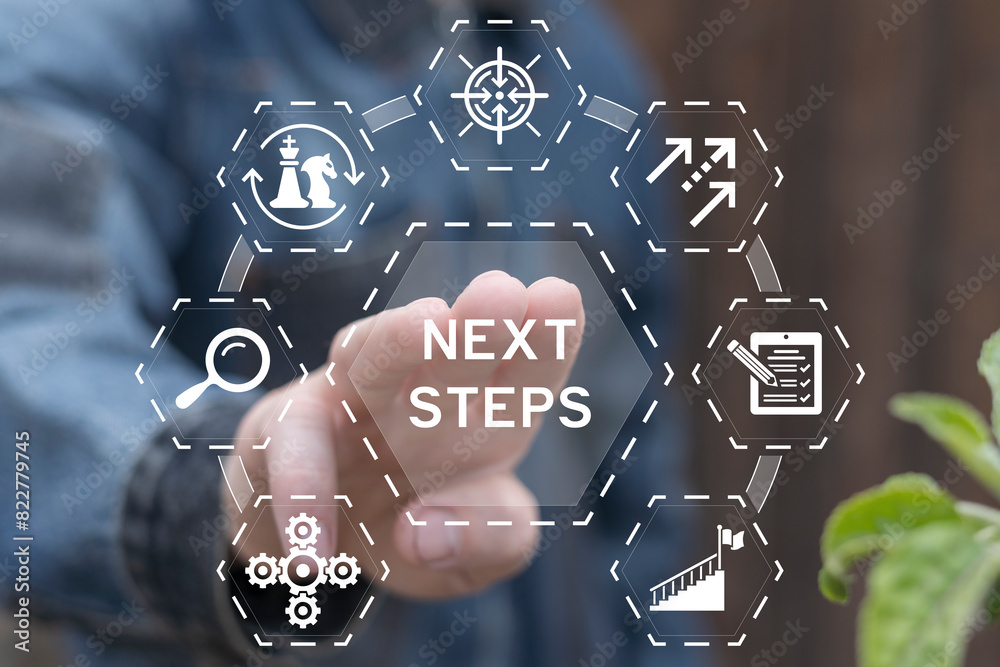 Man working on virtual touch screen presses inscription: NEXT STEPS. Next steps business concept. Next step of work, plan, strategies, vision, project implementation, new opportunities and execution.