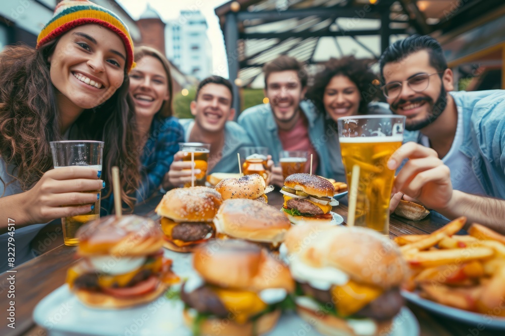 A diverse group of friends dine at an outdoor cafe, enjoying burgers and drinking beer together. A diverse group of friends dine at an outdoor cafe, enjoying burgers and drinking beer together.